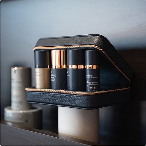 Skincare products in a stylish black case.